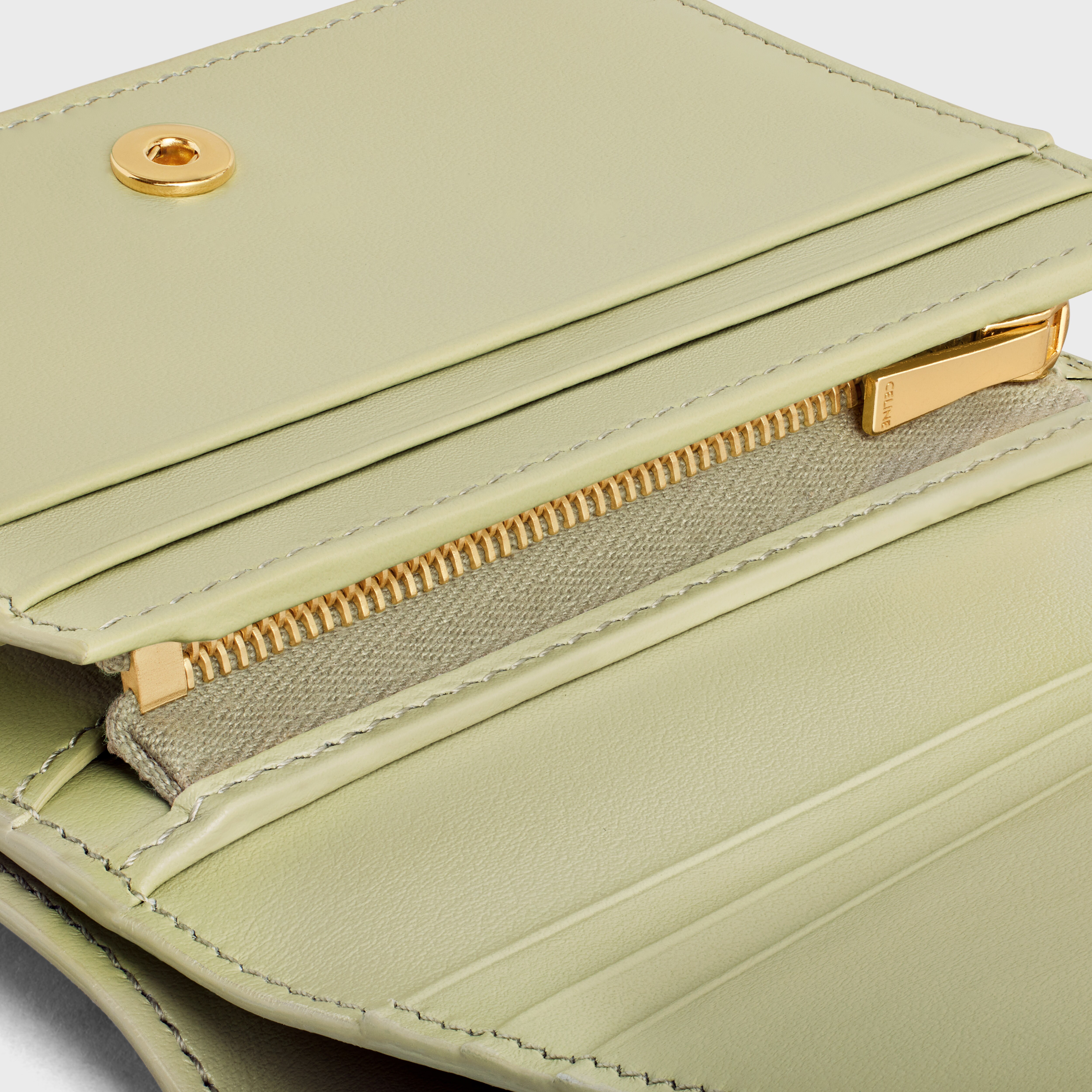 TRIOMPHE COMPACT WALLET IN SHINY CALFSKIN - ALMOND GREEN